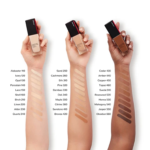 Image 1 - Image shows four arms displaying various shades of foundation in glass bottles, with color swatches labeled alongside; visible text includes foundation shade names and numbers such as Alabaster 110, Sand 250, Cedar 430, and Obsidian 560.
Image 2 - A split image shows a womans face with the left side labeled BEFORE appearing less even-toned and the right side labeled AFTER showing improved skin tone with a visible product name 320 Pine.
Image 3 - A row of Shiseido foundation bottles against a warm gradient background, with text displaying SYNCHRO SKIN 24-Hour Wear* Flawless to the Finish. Available in Matte and Radiant Finishes.
Image 4 - A side-by-side comparison of two Shiseido foundation products, one labeled Synchro Skin Self-Refreshing Foundation SPF 30 Matte with details about climate-adaptive formula and all day hydration, and the other labeled Synchro Skin Radiant Lifting Foundation SPF 30 Radiant with details about lifting and firming bare skin and 24-hour hydration, both featuring a 24-hour wear claim.
Image 5 - Image of three Shiseido foundation products with their details listed in a table format, including the names Revitalessence Skin Glow Foundation, New Synchro Skin Self-Refreshing Foundation, and New Synchro Skin Radiant Lifting Foundation, along with coverage, wear, finish, and skincare benefits for each product.