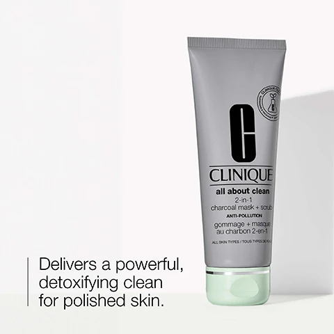 Image 1 - A silver tube of Clinique All About Clean 2-in-1 Charcoal Mask + Scrub is displayed, with visible text reading Delivers a powerful, detoxifying clean for polished skin and ANTI-POLLUTION.
Image 2 - A smear of gray exfoliating product is shown on a white background, with the words exfoliate and refine accompanied by icons for each term.