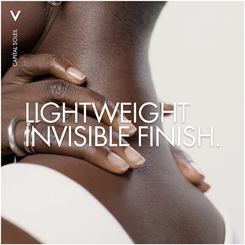 Image 1 - A close-up image of a person’s neck and shoulder with hands gently resting on the skin, featuring visible text that reads CAPITAL SOLEIL LIGHTWEIGHT INVISIBLE FINISH.
Image 2 - An orange spray bottle of Vichy Capital Soleil sunscreen with the text ADVANCED UV PROTECTIVE FILM TECHNOLOGY, SPF 50+, UVB, UVA, LONG UVA, and CELL PROTECT INVISIBLE WATER FLUID SPRAY.
Image 3 - A woman with long dark hair is holding a bottle of sunscreen while sitting with her legs crossed, wearing a white swimsuit against a light background. The visible text on the sunscreen bottle includes SPF 50.
Image 4 - Image shows two sun protection products by Vichy on a textured white background; the left bottle labeled For Face: UV-Age Daily and the right labeled For Body: Cell Protect Water Fluid Spray with a sun protection factor of 50.
Image 5 - A person in a white coat holds a bottle of Vichy Capital Soleil sunscreen, with the text on the left reading Hypoallergenic Non-greasy Tested by Dermatologists.