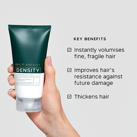 Image 1 - A hand holds a dark green and white tube of Philip Kingsley Density Thickening Conditioner, which states it volumises and strengthens fine, fragile hair, with 175ml 5.91 fl oz visible, while to the right, Key Benefits are listed as: Instantly volumises fine, fragile hair, Improves hairs resistance against future damage, and Thickens hair. Image 2 - A dark green product image features a Philip Kingsley Density Thickening Conditioner tube standing on a white pedestal, with text overlays reading It has RESTORED my very thinning hair back into my THICKER HAIR that I am used to!, SIGNIFICANTLY REDUCES THE LIKELIHOOD OF HAIR BREAKAGE**, PHILIP KINGSLEY DENSITY THICKENING CONDITIONER APRÈS-SHAMPOOING ÉPAISSISSANT Volumises and strengthens fine, fragile hair Donne du volume aux cheveux fins et fragiles et les renforce 90ml 3.0 fl oz, and *USER TRIAL PANEL COMMENT **INDEPENDENT INSTRUMENTAL TESTS OF DENSITY SHAMPOO & CONDITIONER, COMPARED TO BOTH UNTREATED HAIR AND HAIR TREATED WITH A LEADING VOLUMISING SHAMPOO & CONDITIONER. Image 3 - The image displays a list of four key benefits: Adds shine and gloss, Increases hair volume, Reduces hair breakage, Hydrates and smoothes strands. Image 4 - The image shows four Philip Kingsley Density hair care products in dark green and white packaging, arranged to illustrate a four-step routine with the title DENSITY: FOR FULLER, THICKER HAIR. The steps and corresponding products are: STEP 1 CLEANSE with Philip Kingsley Density Thickening Shampoo, STEP 2 CONDITION with Philip Kingsley Density Thickening Conditioner, STEP 3 PRESERVE with Philip Kingsley Density Preserving Scalp Drops, and STEP 4 PROTECT with Philip Kingsley Density Thickening Protein Spray.