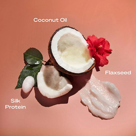 Image 1 - A halved coconut with a flower beside it is displayed on a pink background, with labels reading Coconut Oil, Flaxseed, and Silk Protein positioned around the image.
Image 2 - A jar of SheaMoisture Curl Defining Gel for curly and coily hair is displayed on a peach background, with text highlighting benefits: great for curly and coily hair, strong curl definition, provides shine and smoothness, perfect for twist-out, braid-out or wash-and-go styles, and non-sticky, non-alcohol.
Image 3 - A coconut shell with pieces of coconut meat and a vibrant red hibiscus flower are arranged on a pink background, with the words Coconut Oil, Hibiscus Flower, and Shea Butter displayed above.