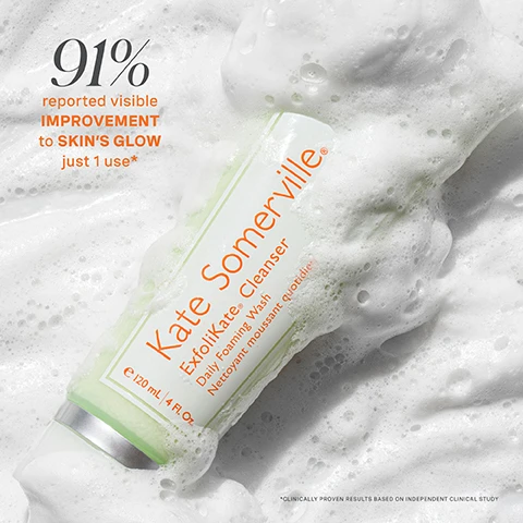 Image 1 - A foam-covered bottle of Kate Somerville Exfolikate Cleanser is shown, with bold text stating 91% reported visible improvement to skins glow just 1 use.
Image 2 - A smiling woman with short hair and glowing skin holds a turquoise skincare product to her forehead against a green background, with text stating No White Cast, Deep Hydration, Illuminating Finish and AN SPF YOULL LOOK FORWARD TO WEARING.
Image 3 - A split image shows a persons face with visible skin improvements; the left side labeled before shows redness and blemishes, while the right side labeled after 1 use shows clearer skin. Visible text includes before, after 1 use*, and clinically proven results based on independent clinical study.
Image 4 - Three women with diverse skin tones smile while holding teal skincare products, with text above them reading protect + hydrate + illuminate and text at the bottom stating no. white. cast.