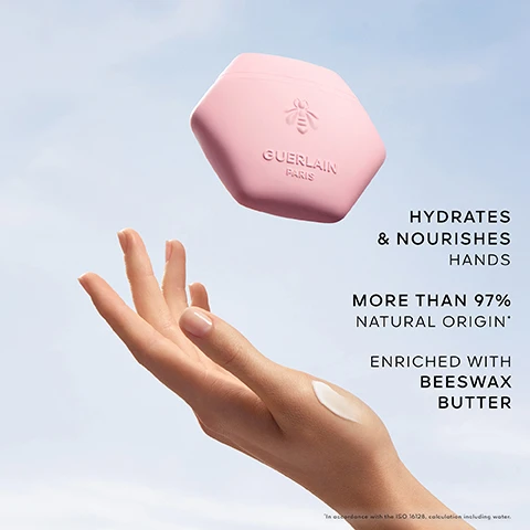 Image 1 - A woman’s hand is shown reaching for a pink hexagonal container labeled Guerlain Paris, with text next to the hand stating hydrates & nourishes hands, more than 97% natural origin, and enriched with beeswax butter.
Image 2 - A collection of various roses and petals in soft colors, with visible text stating Lychee Note, Blackcurrant Note, Rose.
Image 3 - An elegant bottle of Guerlains Aqua Allegoria Rosa Rossa perfume stands next to a pink jar labeled Guerlain Paris, with the text ROSA ROSSA SCENTED RITUAL visible in the top left corner.